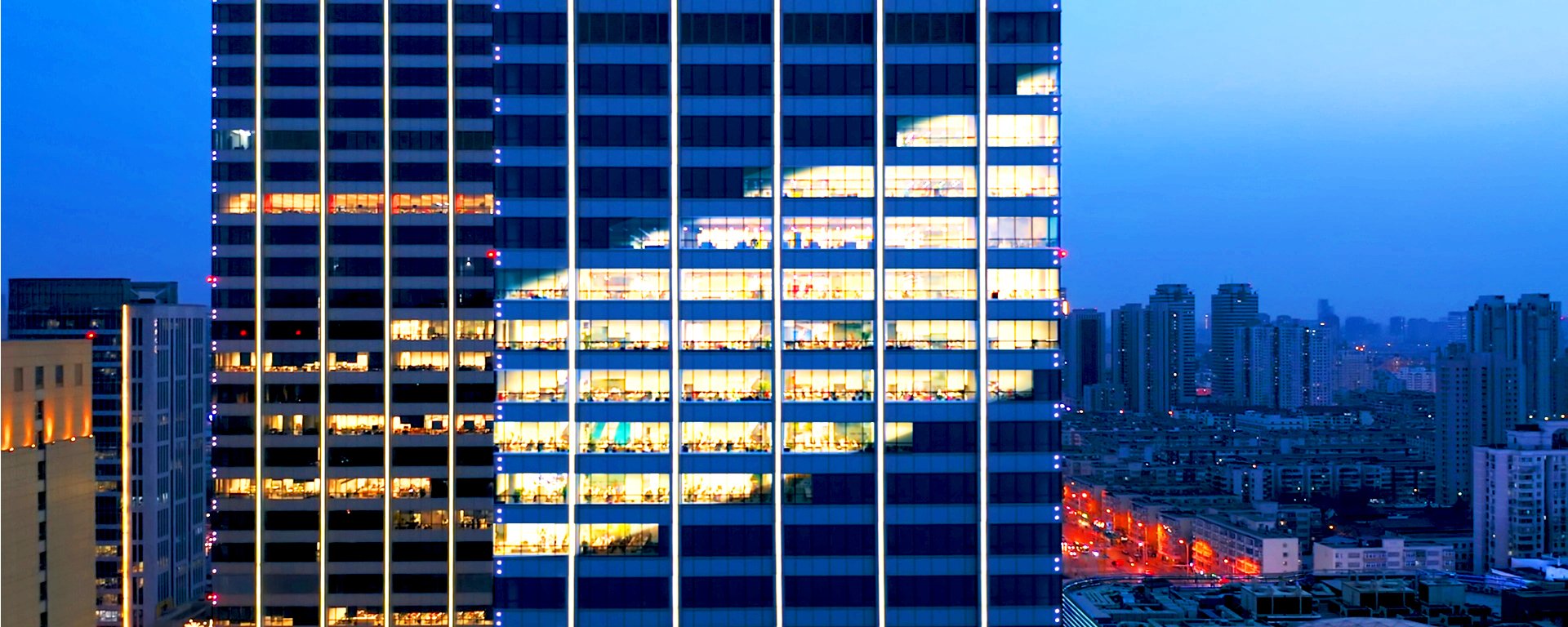 Building with lights in the shape of the Liberty logo.