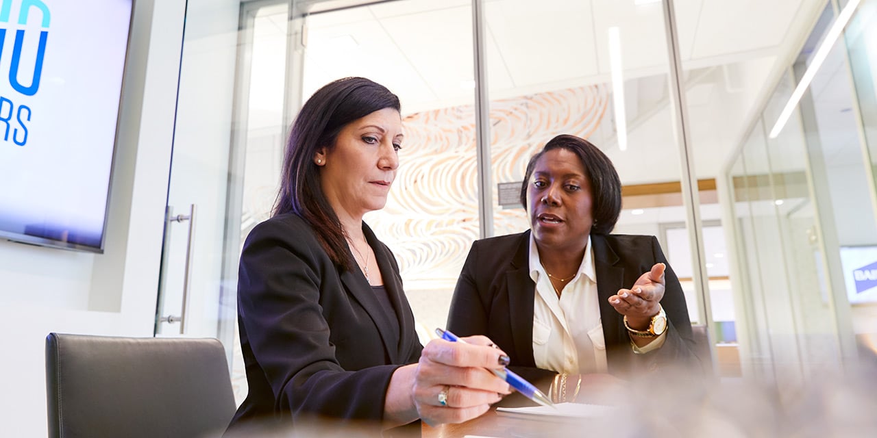Photo of Jacci McCoy and Tammy Jelinek in Liberty office