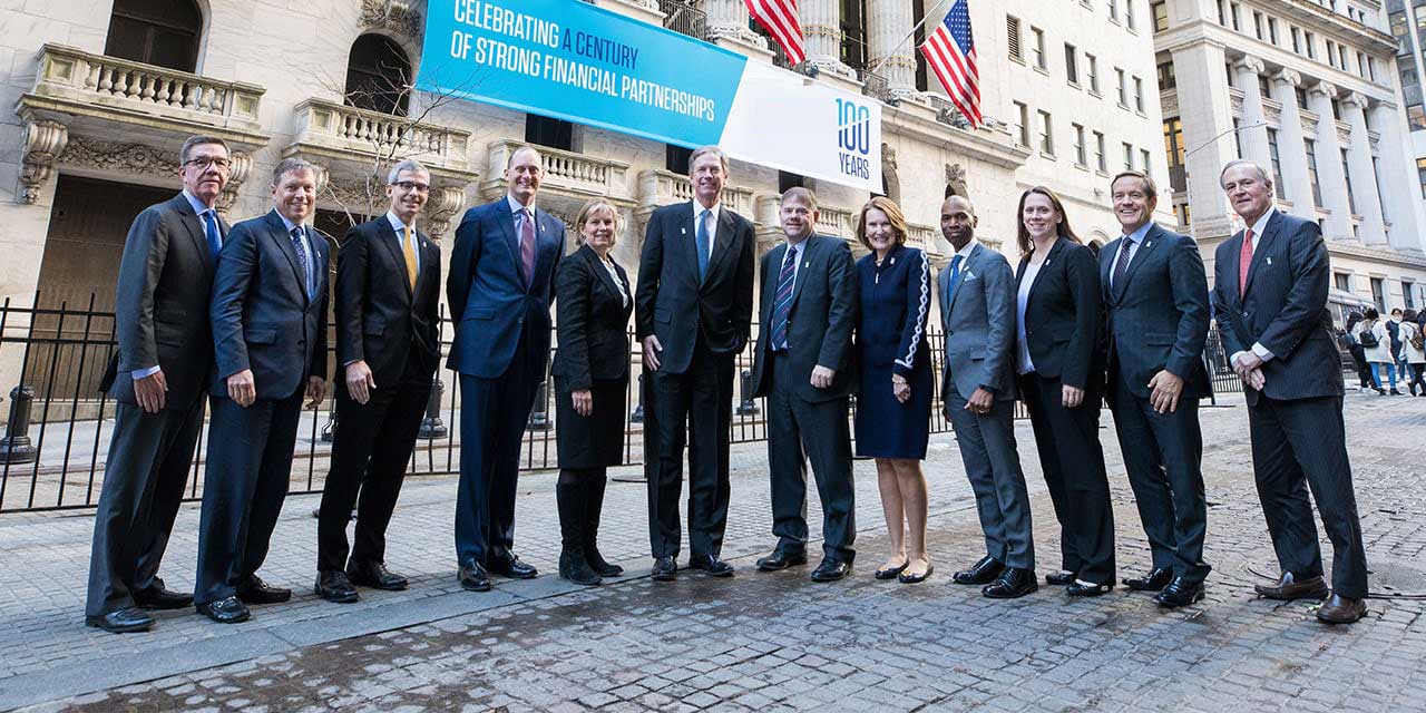  Liberty Executive Committee standing in front of the New York Stock Exchange building.